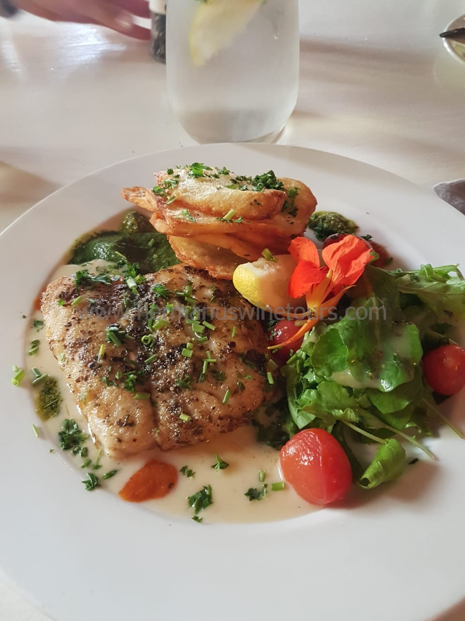 Grilled Hake fillet, crispy potatoes, tangy salad, Hermanus restaurant, near Cape Town, South Africa